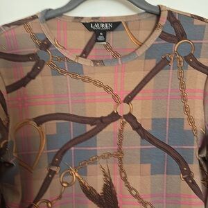New without tag Raph Lauren beautiful long sleeve top. Size M. Riding pattern.